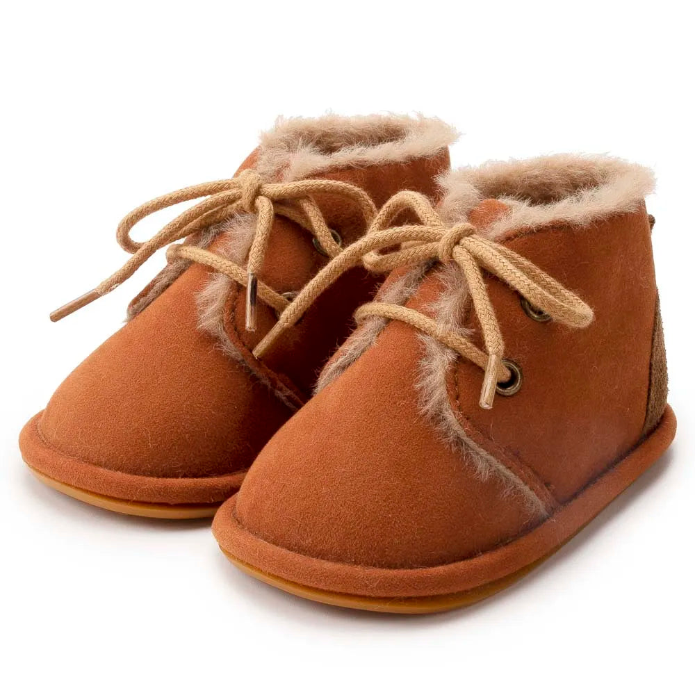 Soft newborn shoes, designed for warmth and comfort, perfect for crib wear in winter.