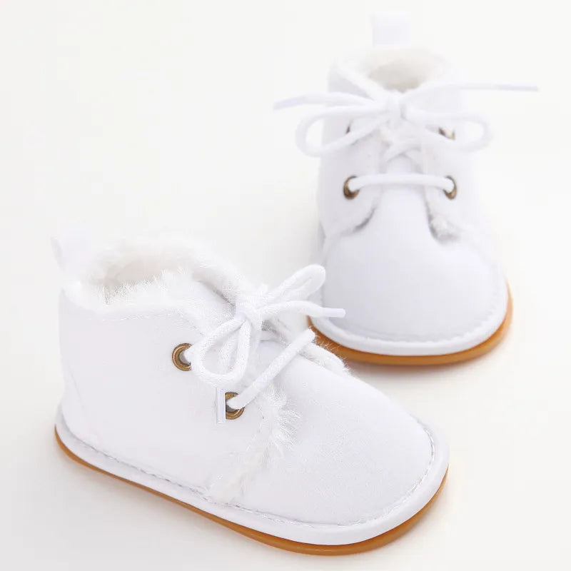 Cozy toddler crib shoes in a charming design, suitable for baby fashion and cold weather.