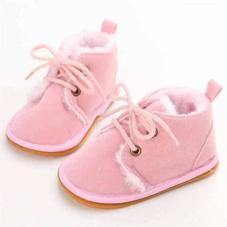 Plush baby crib shoes, ensuring warmth and comfort for little feet during cold months.