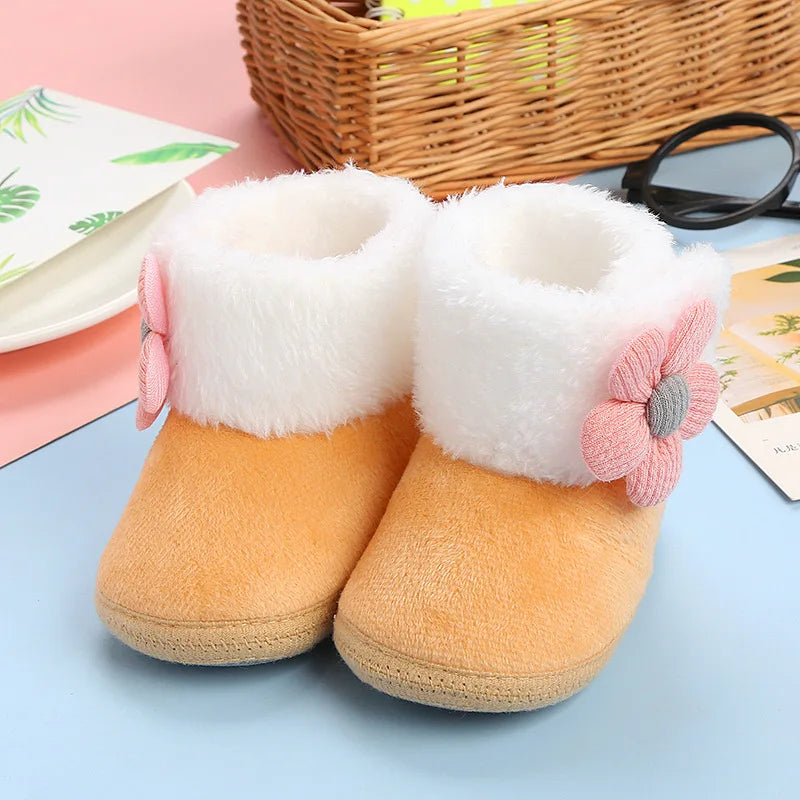 Soft knitted winter boots for baby girls, featuring a lovely flower print and non-slip bottom