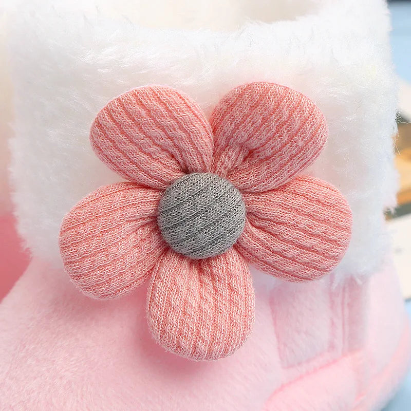 Close-up of the non-slip sole on warm baby boots with flower print, safe for infants