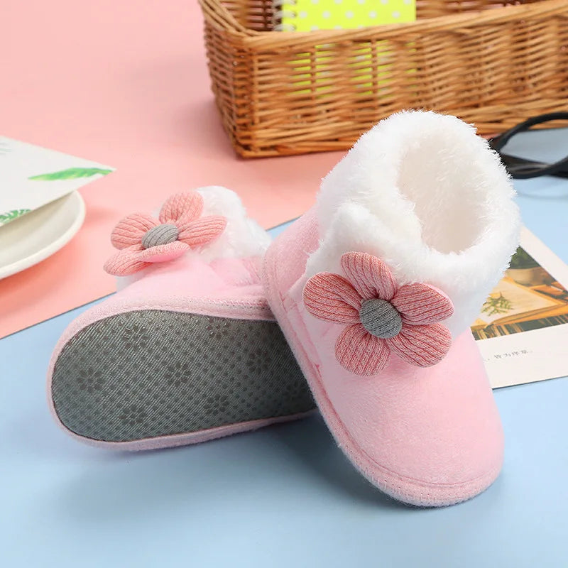 Pair of toddler winter boots, pink with flower print, soft and non-slip for baby girls