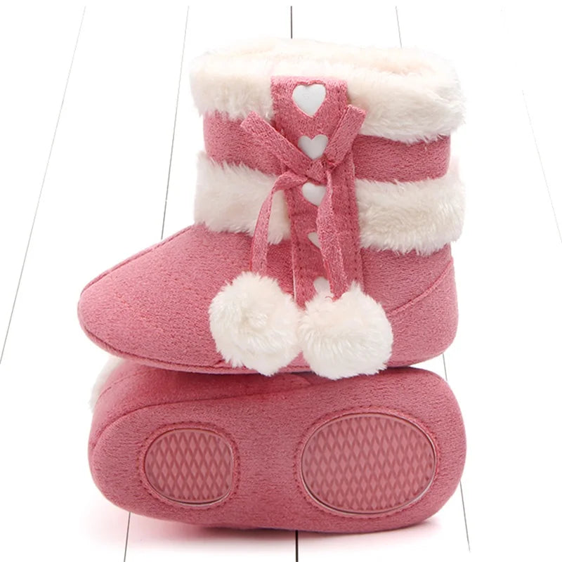 Toddler snow boots in a neutral color, perfect for keeping baby's feet warm in winter