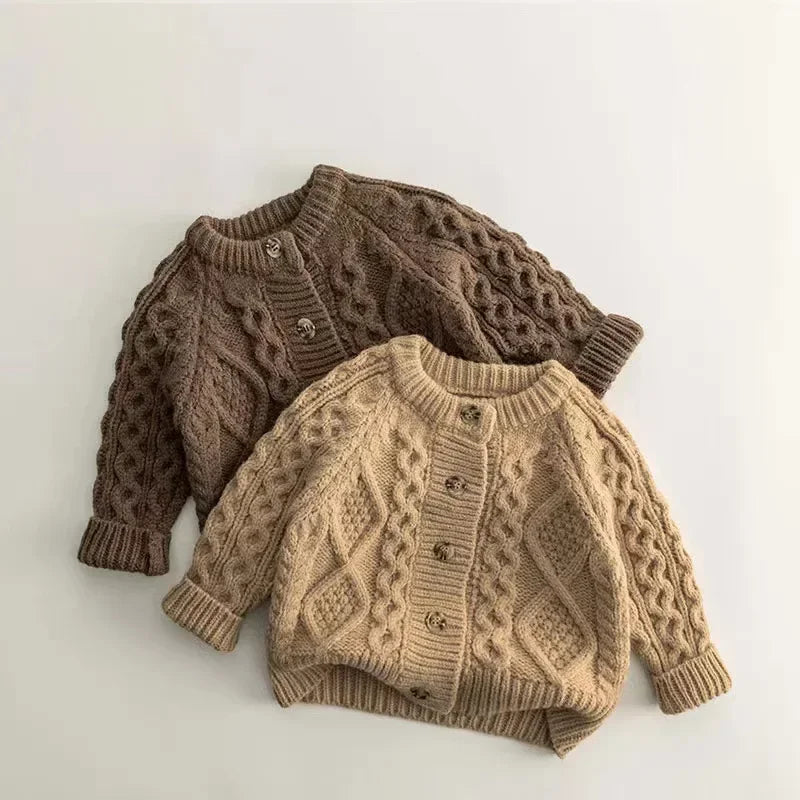Warm beige knitted kids' sweater, perfect for winter, on a white background