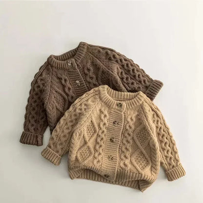 Warm beige knitted kids' sweater, perfect for winter, on a white background