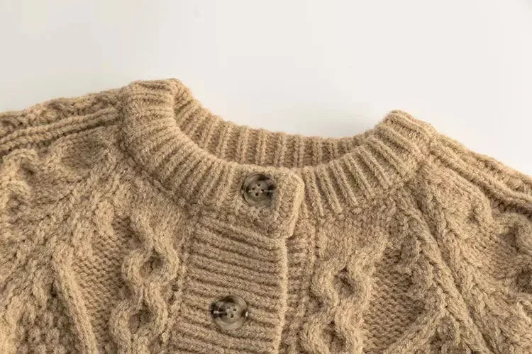 Close-up of the chunky knit pattern on a children's warm winter sweater