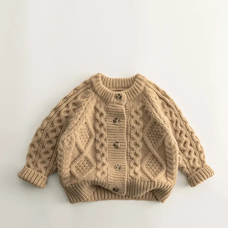 Detail of the ribbed cuffs and hem on a comfortable children's knit sweater