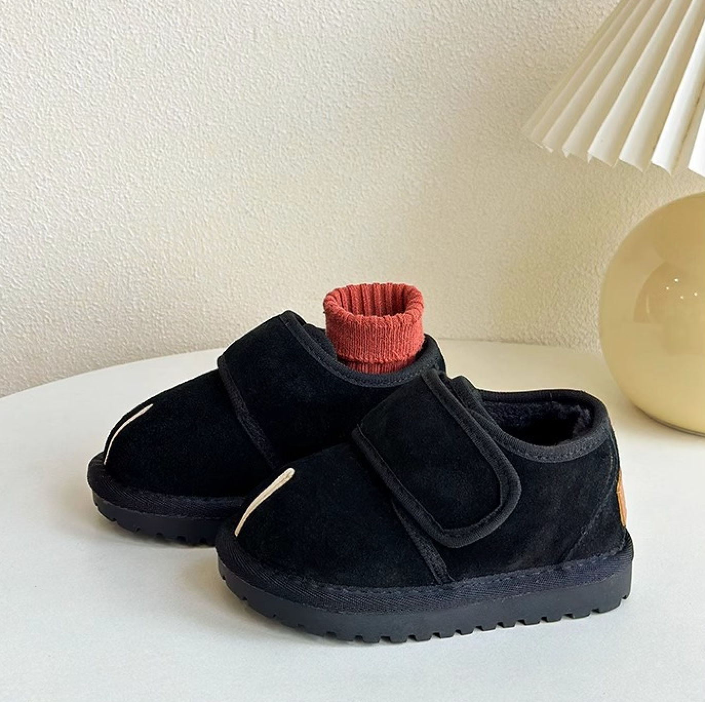 Kids' warm black boots with strong Velcro, excellent non-slip support for winter activities.