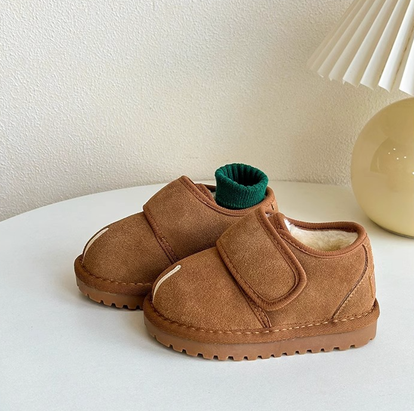 Hard-wearing brown kids' Velcro boots, designed for comfort and cold-weather protection.
