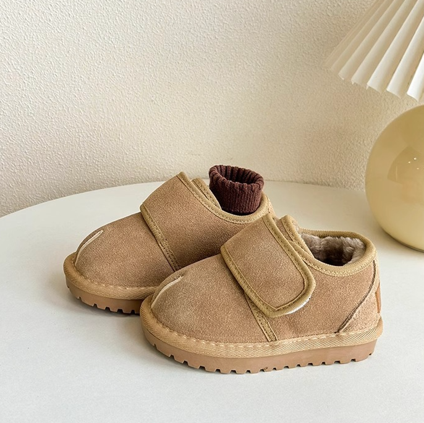 Unisex beige baby winter boots with easy Velcro closure, ensuring warm tiny feet.