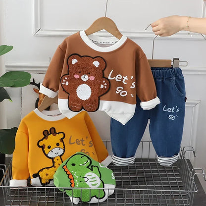 Close-up of soft cotton blend fabric on a brown kids winter hoodie and pants set