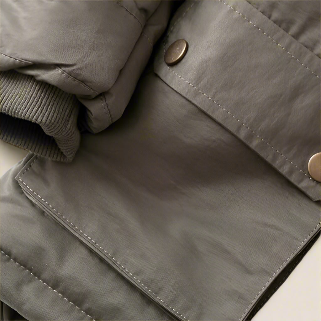 Back view of a children's warm winter coat with faux fur hood, durable outerwear