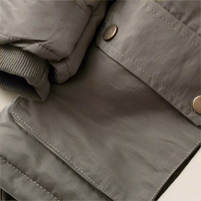 Back view of a children's warm winter coat with faux fur hood, durable outerwear