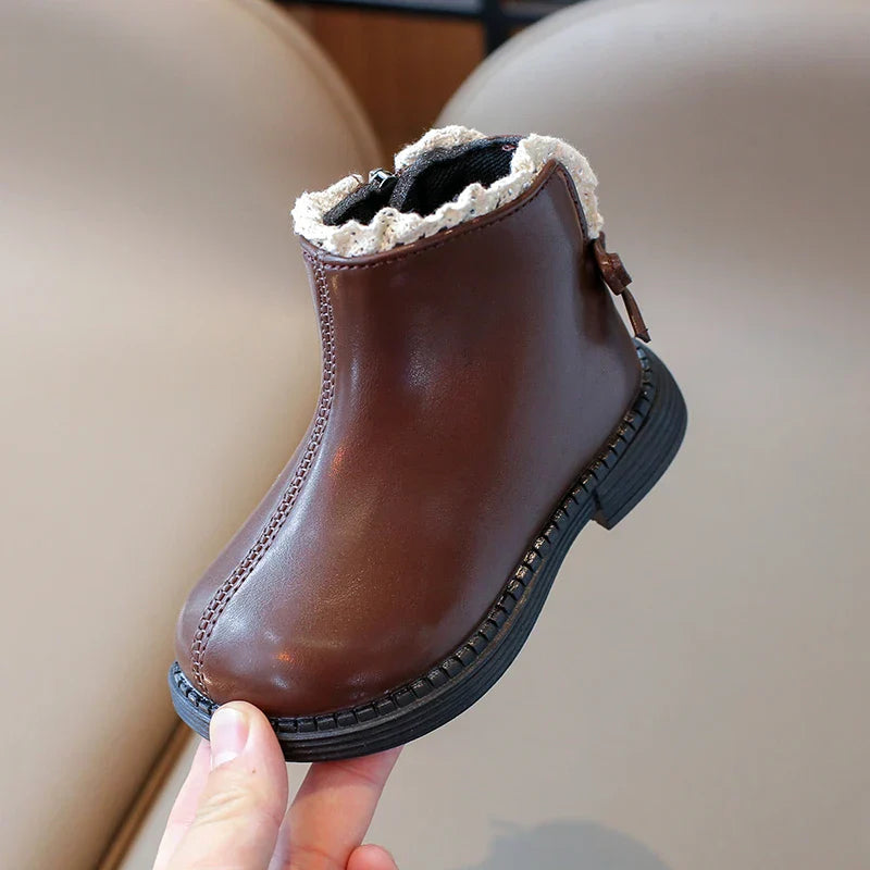 Toddler's winter leather boots with zipper closure, warm and durable for cold weather