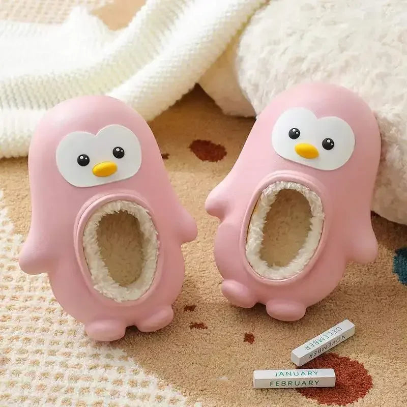 Indoor toddler slippers with an adorable penguin design, keeps feet warm