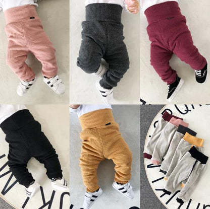 Warm, cozy unisex baby ribbed cotton fleece-lined pants in a neutral color, perfect for toddlers.