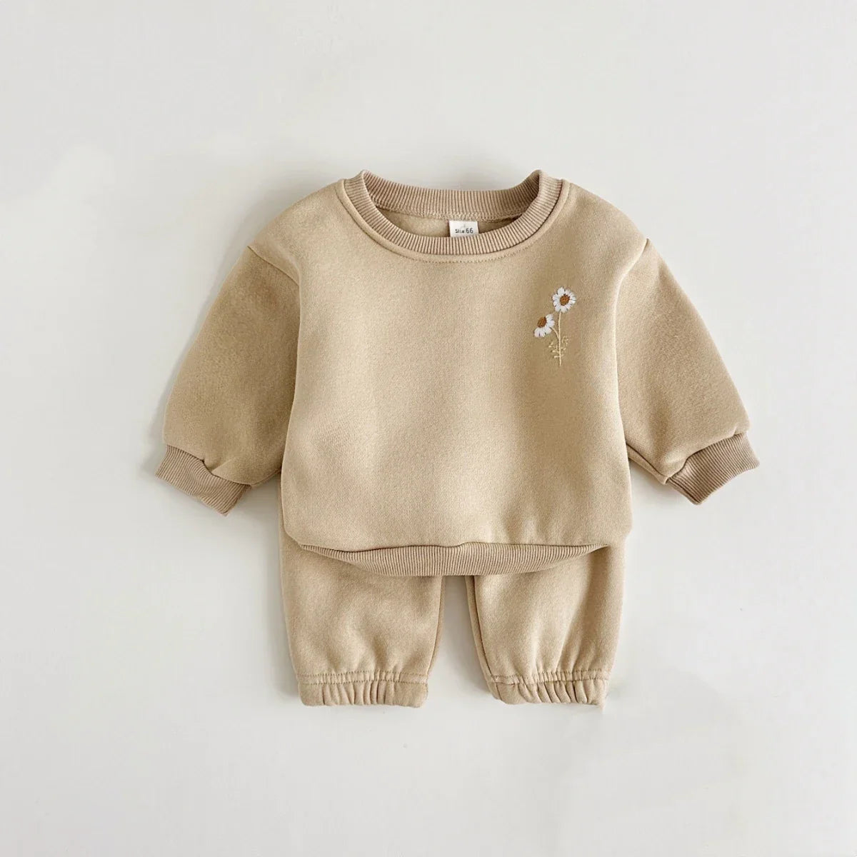 Pink long-sleeved floral embroidered jacket from a warm winter tracksuit for baby girls