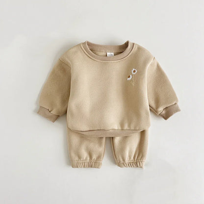 Pink long-sleeved floral embroidered jacket from a warm winter tracksuit for baby girls