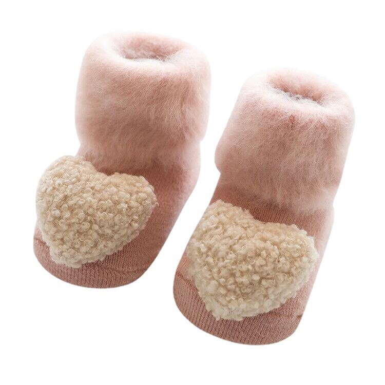 Secure & warm baby socks, fur-lined with anti-slip sole, ensuring comfort for growing feet.