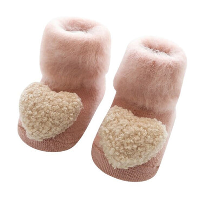 Secure & warm baby socks, fur-lined with anti-slip sole, ensuring comfort for growing feet.