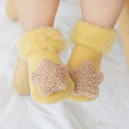 Cozy baby clothing item: unisex fur-lined anti-slip socks for ultimate winter comfort.