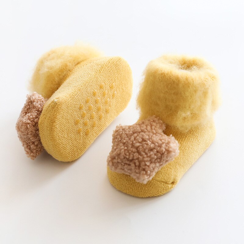 Toddler warm socks with fur lining and anti-slip grips, a must-have for cold season.
