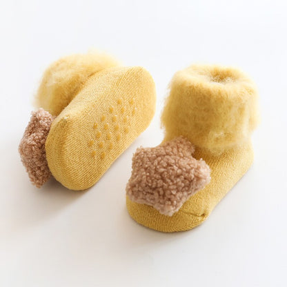 Toddler warm socks with fur lining and anti-slip grips, a must-have for cold season.