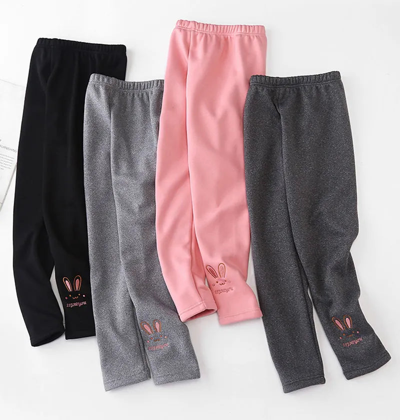 Stylized image of girls' leggings with whimsical rabbit artwork, cozy and charming