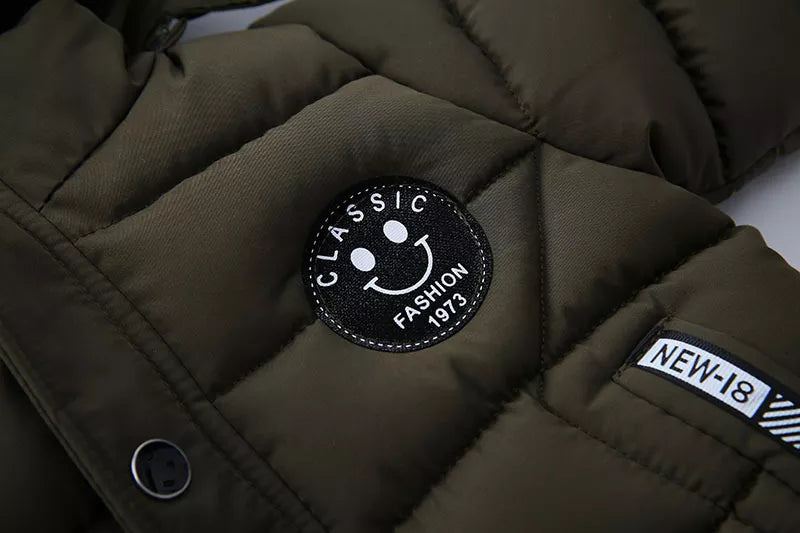 Close up of water-resistant fabric on a kids' hooded winter puffer jacket, boys or girls.