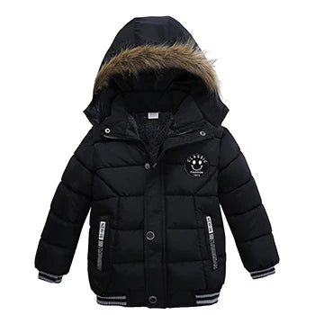 Child wearing a hooded winter puffer jacket, playing in snow, showing active fit, boys or girls.