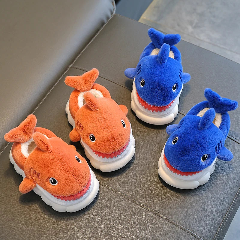 Warm and playful children's winter slippers, shaped like a cartoon shark, with a non-slip sole.