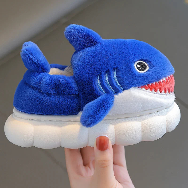 Soft blue cotton shark slippers for kids, providing cozy warmth and a secure non-slip bottom.