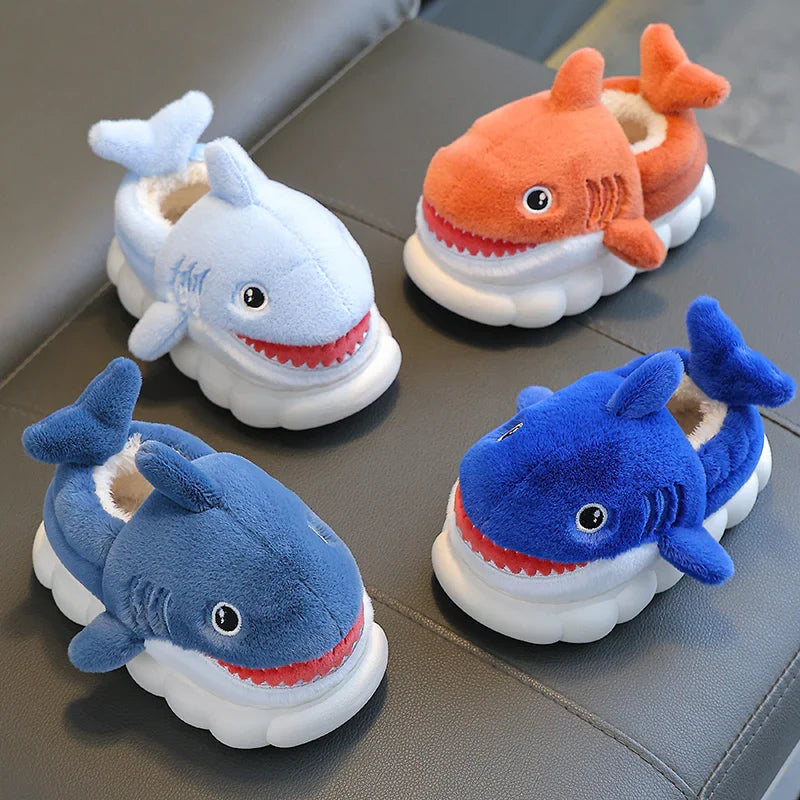 Childrens' plush shark winter slippers in a vibrant blue, soft cotton, featuring a playful design.