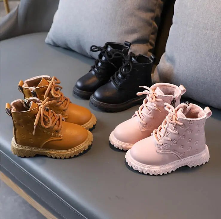 Outdoor scene: child wearing warm plush-lined winter boots in snowy conditions