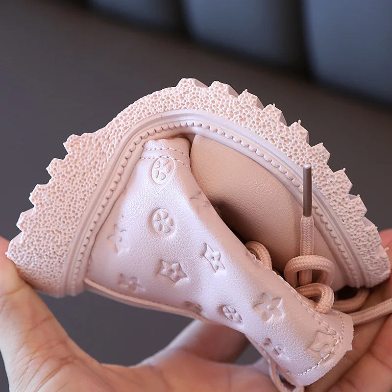 Toddler's plush-lined winter boots in a fashionable design, offering ultimate warmth