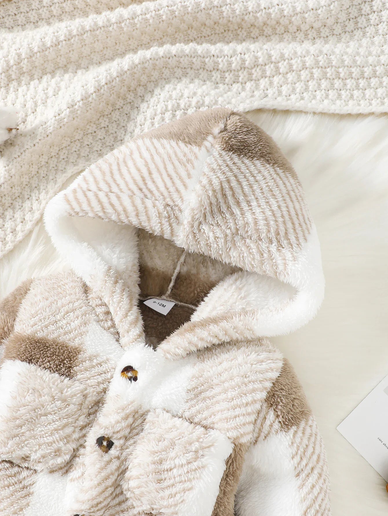 Cozy baby plaid hooded romper, perfect unisex newborn outfit for cold weather.