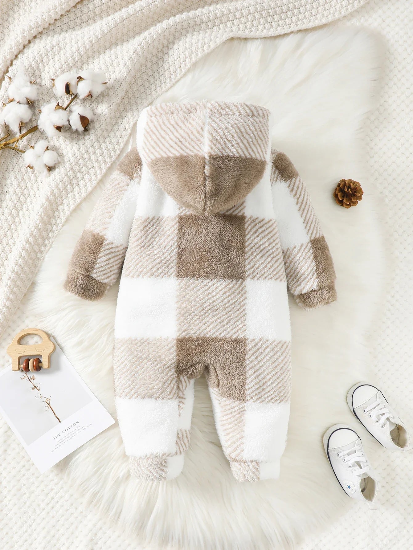 Cute baby plaid hooded jumpsuit, essential winter clothing for newborns and infants.