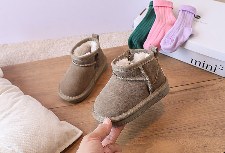 Play-ready brown children's boots, plush lined for warmth during active winter days.