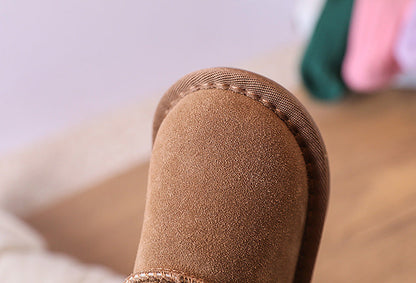 Comfortable and warm brown toddler ankle boots, lined with soft plush for winter wear.