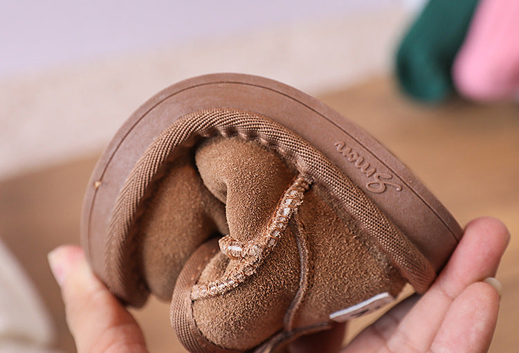 Unisex children's brown winter boots, plush-lined for ultimate warmth and comfort.