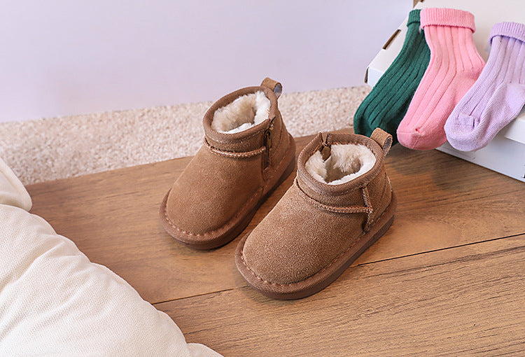 Side view of warm children's brown winter boots, featuring a cozy faux fur interior.