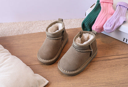 Stylish brown winter ankle boots for children, extra warm with full faux fur lining.