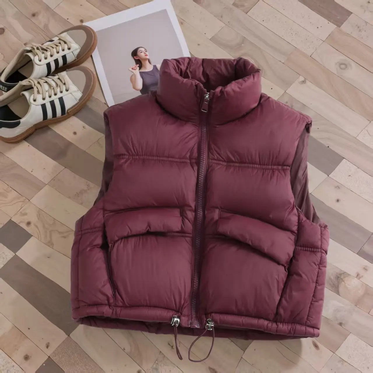 Close-up of a cozy kids' puffer vest zipper and high collar, warm winter bodywarmer detail
