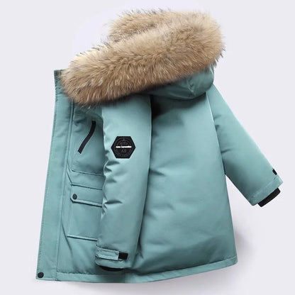 Group of diverse kids wearing various colors of warm waterproof winter coats, playing outside.