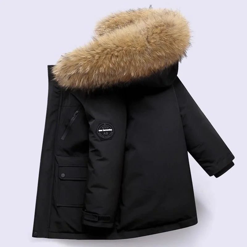 Little boy happily wearing a warm, waterproof blue winter coat, playing outdoors in snow.