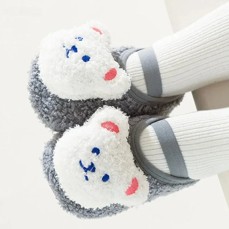Non-slip bear slippers, essential baby and toddler footwear for cold seasons.