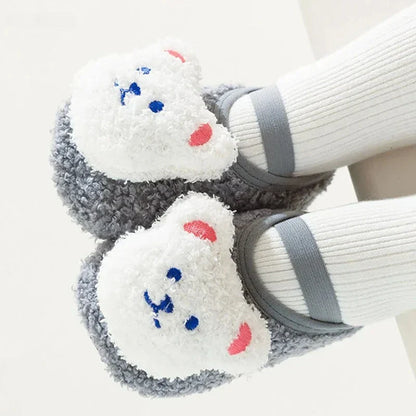 Non-slip bear slippers, essential baby and toddler footwear for cold seasons.