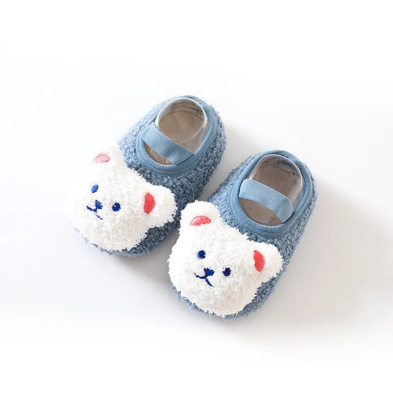 Toddler's cozy bear slippers, designed for warmth, comfort, and slip-free movement.