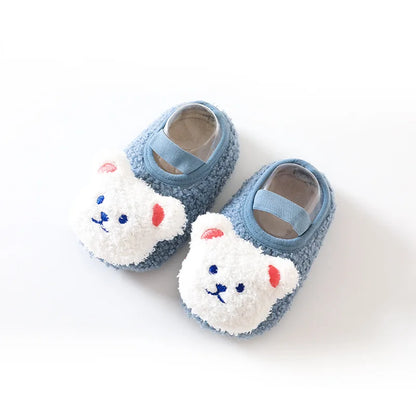 Toddler's cozy bear slippers, designed for warmth, comfort, and slip-free movement.