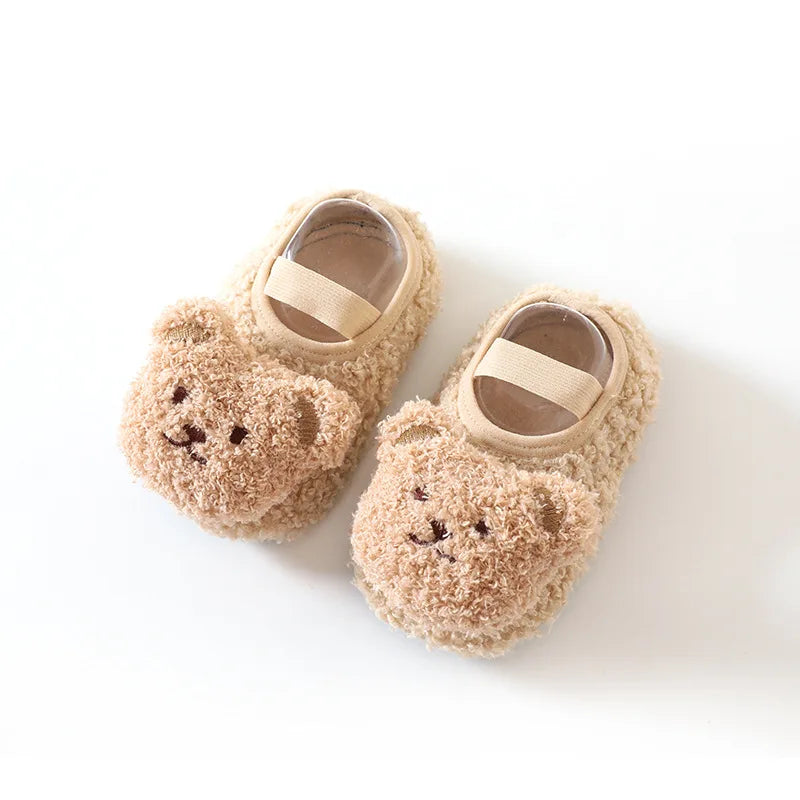 Baby's unisex bear slippers, perfect for warmth and non-slip safety on any surface.